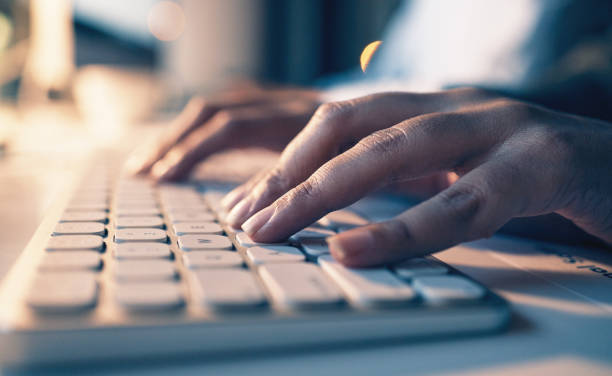 istock Typing, computer and night with hands of person in office for email, overtime and project proposal. Technology, internet and search with employee and keyboard for report, deadline and planning 1627602648