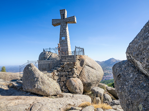 Alpine Cross for travelers in the Bavarian Alps close to Hitler's Eagles Nest and the German village of Berchtesgaden, Cross of Kehlstein moody sky