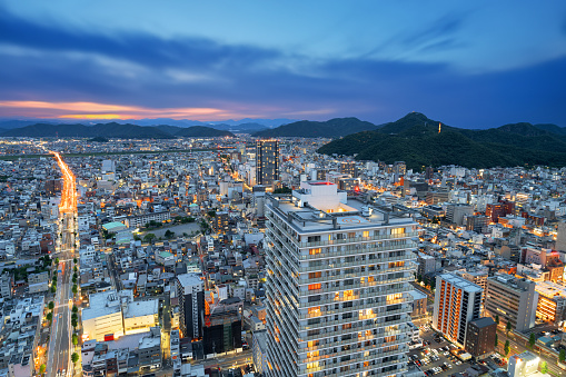Gifu City, Gifu Prefecture, Japan cityscape from above with the mountains at dusk.
