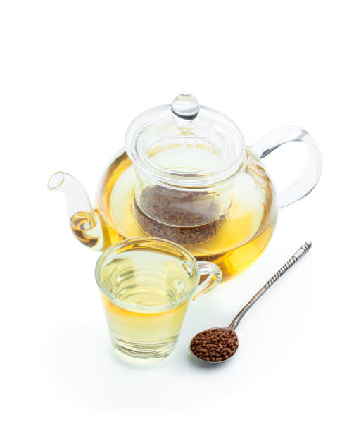 istock Buckwheat tea in transparent teapot isolated on white 1627694907