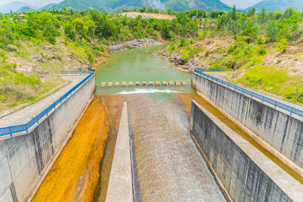 The old dam. An artificial lake (reservoir) near Nha Trang in Vietnam. technical routine stock pictures, royalty-free photos & images