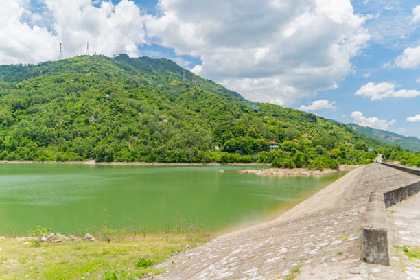 The old dam. An artificial lake (reservoir) near Nha Trang in Vietnam. technical routine stock pictures, royalty-free photos & images