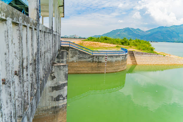 The old dam. An artificial lake (reservoir) near Nha Trang in Vietnam. technical routine stock pictures, royalty-free photos & images