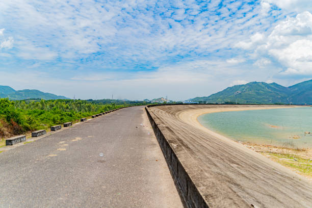 The old dam. An artificial lake (reservoir) near Nha Trang in Vietnam. technical routine stock pictures, royalty-free photos & images