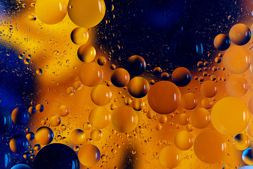 bright colorful abstract background, oil drops on the water surface , macro photography