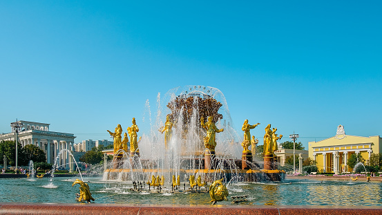 Moscow, Russia-August 10, 2023: Big beautiful golden fountain Friendship of people situated on exhibition of Economic achievements in Moscow, Russia.  Famous touristic place.