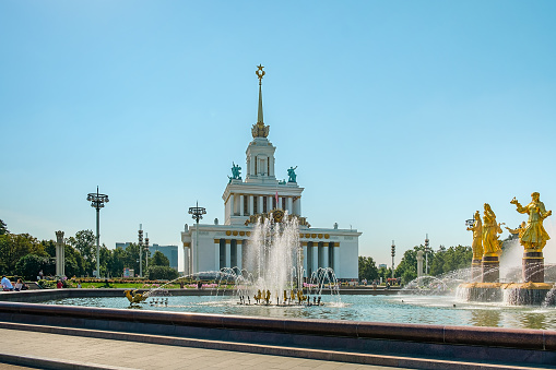Moscow, Russia-August 10, 2023: Big beautiful golden fountain Friendship of people situated on exhibition of Economic achievements in Moscow, Russia.  Famous touristic place.