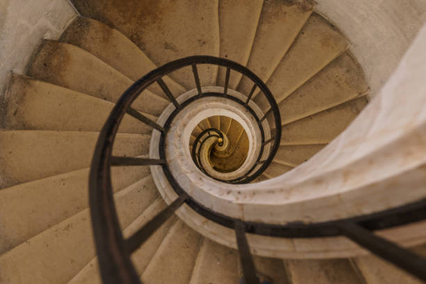 istock Beautiful old dilapidated spiral staircase with a metal railing destroyed. 1627731426