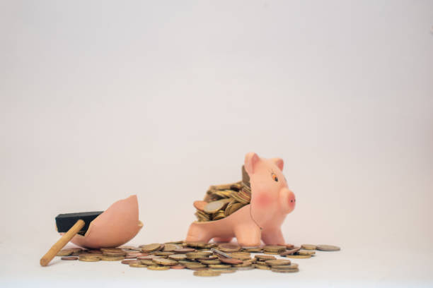 istock Broken piggybank with Euro coins on a white background. 1627755519