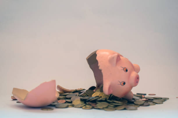 istock Broken piggybank with Euro coins on a white background. 1627759070