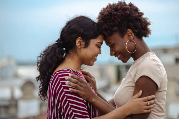 istock Loving lesbian couple having romantic moments on a rooftop 1627773274