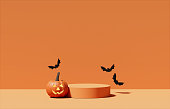 3D pedestal podium, orange background. Pumpkin falling with flying bat . Halloween Jack o lantern display showcase. Autumn product promotion. Abstract spooky fall. 3D render illustration