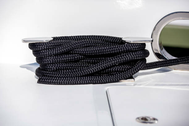 stainless steel cleat and black rope on luxuty yacht, background with copy space - sailing ship nautical vessel rigging industrial ship imagens e fotografias de stock