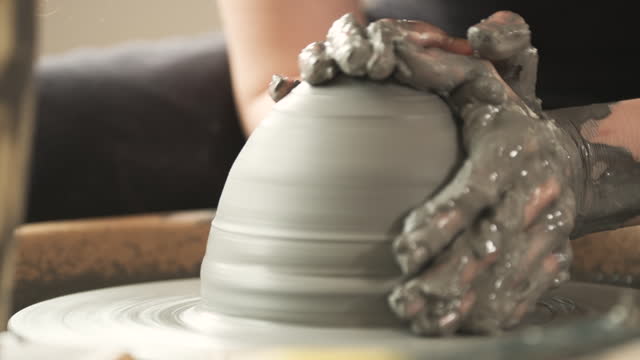 Potter Artist Working on Pottery Wheel in Atelier
