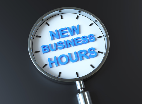 NEW BUSINESS HOURS notice in Magnifying Glass