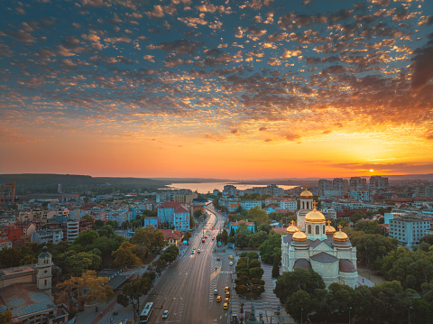 Varna city by sunset, Bulgaria and The Cathedral of the Assumption. Tourism and travel destination on bulgarian seaside, aerial landscape view