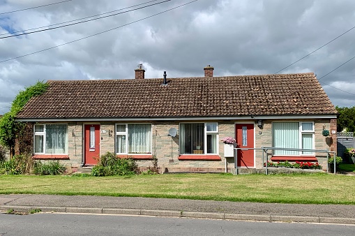 Soham, UK - August 19, 2023: Two attached bungalows for elderly people in the village of Soham, Cambridgeshire, UK.