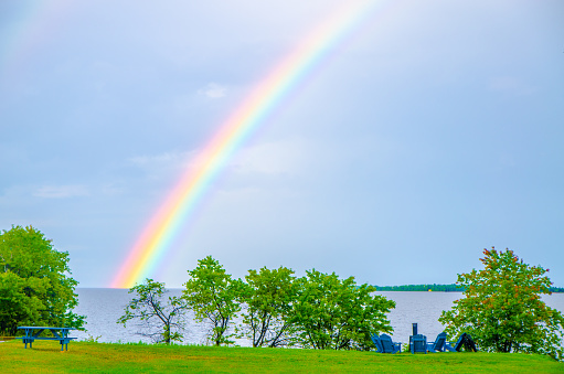 Rainbow over St-Jean Lake in Quebec during summer day
