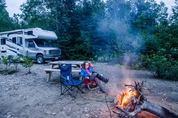 istock Mature woman in front of campfire 1628091014