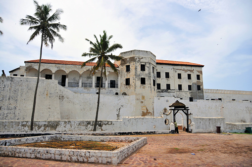 Elmina, Ghana: western walls of São Jorge da Mina Castle, also known as 'Feitoria da Mina', built by Portugal in 1482. First established as a trade settlement, the castle later became one of the most important stops on the route of the Atlantic slave trade. The Dutch took the fort from the Portuguese in 1637, and took over all of the Portuguese Gold Coast in 1642. The slave trade operated under the Dutch until 1814. The historical significance of the fort is that it was the headquarters of the Portuguese in West Africa from 1482 until the Dutch conquest in 1637 and subsequently was the headquarters of the Dutch in West Africa. As a Dutch possession, the fort also played a decisive role in the rise of the Ashanti empire, which was allied with the Dutch. From 1872 until Ghana's independence the fort was British - UNESCO World Heritage Site.