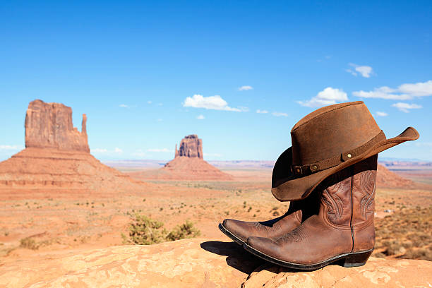 istock cowboy boots and hat in front of Monument Valley 162813320