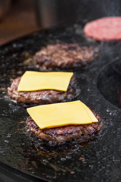 istock Finishing Homemade Cheeseburgers 1628199219