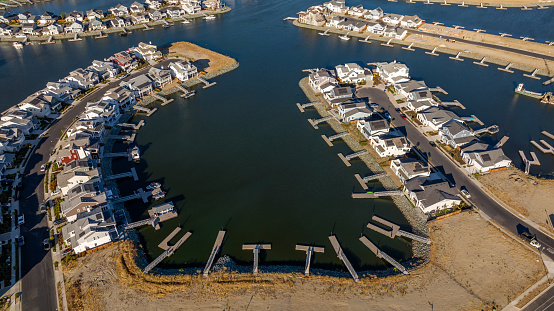 Aerial stock photos of a residential housing community with a berth dock for every home on Bethel Island in California, located in Central California on the San Joaquin River.