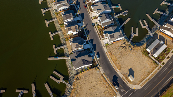 Aerial stock photos of a residential housing community with a berth dock for every home on Bethel Island in California, located in Central California on the San Joaquin River.