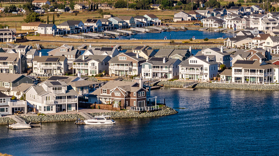 Aerial stock photos of a residential housing community with a berth dock for every home on Bethel Island in California, located in Central California on the San Joaquin River.