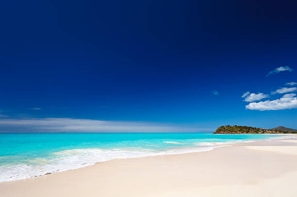 Clean White Caribbean Beach With Blue Sky stock photo