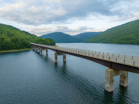 Late afternoon summer aerial photo of the bridge over the Cannonsville Reservoir, Trout Creek, Route 10.