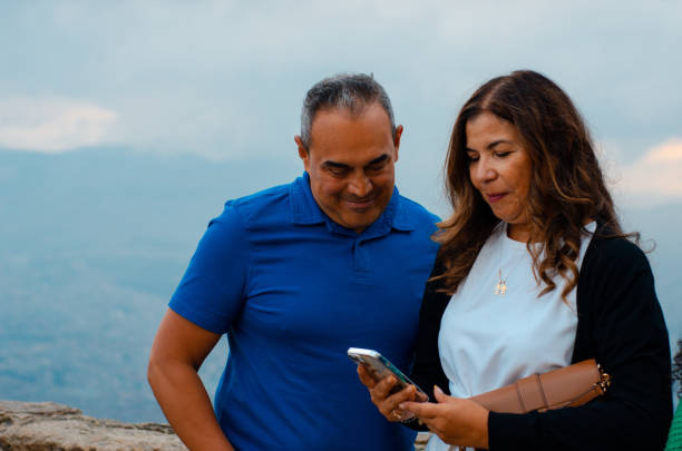 senior couple using a smartphone stock photo
