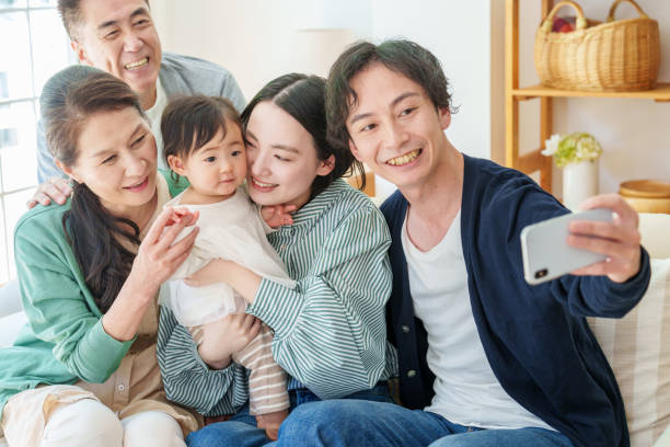 istock three generations asian family taking selfie 1628268399
