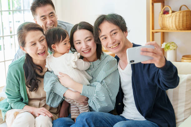 istock three generations asian family taking selfie 1628268491
