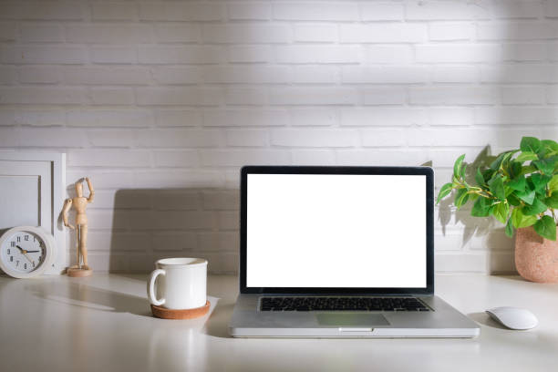 istock Laptop computer, coffee cup, potted plant and picture frame on creative workplace. Blank screen for your advertising text. 1628312259