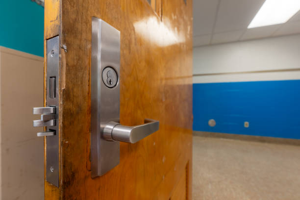 istock Open classroom door with new door hardware with security locks for a lockdown. 1628328005