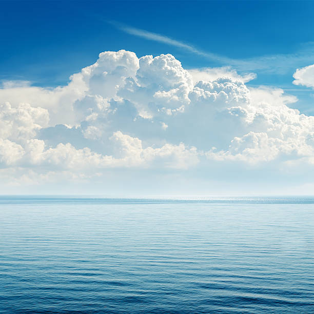 istock blue sea and cloudy sky over it 162834935