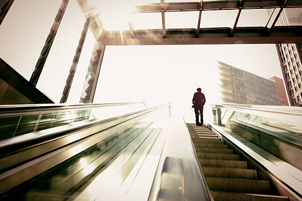 istock Business man on the escalator 162835121