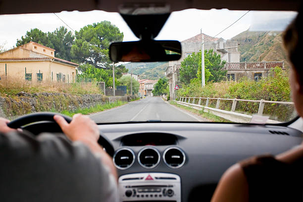 istock Two people car driving down the road 162835529
