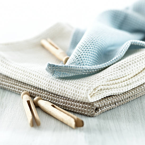 Clothespins on a tea towel stock photo