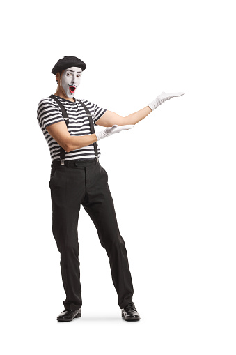 Full length portrait of a mime presenting isolated on white background