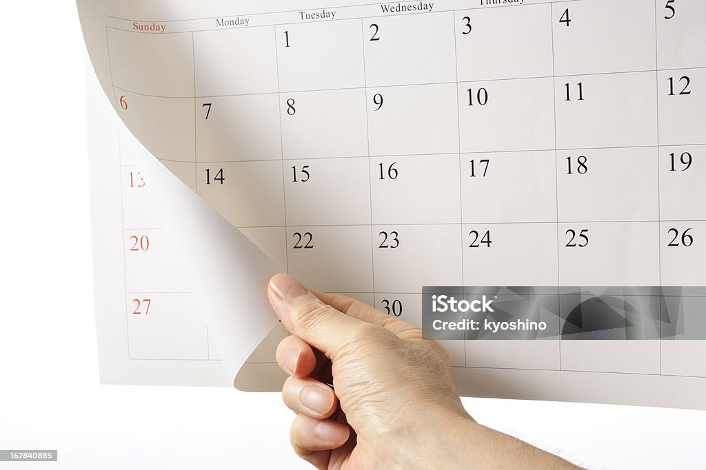ハンド overturns カレンダーシートの背景に白色 - カレンダーのロイヤリティフリーストックフォト