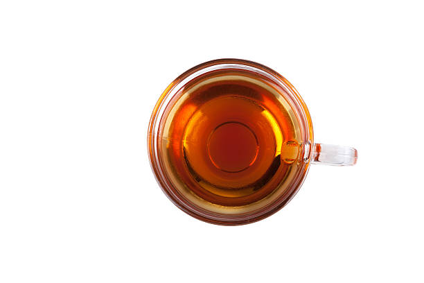 An aerial view of a mug of black tea on a white background stock photo