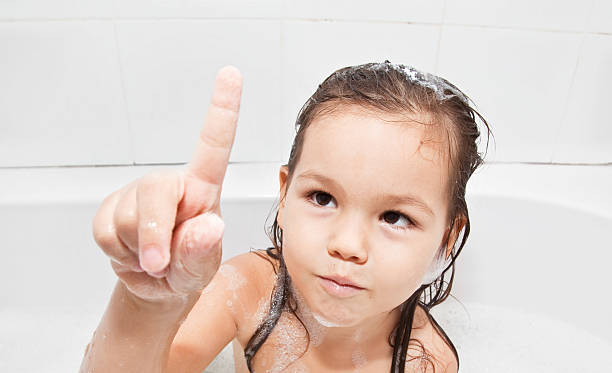 Girl in bath stock photo