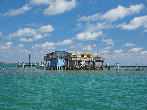 Stiltsville, Biscayne National Park, Florida - 03-01-2019: Miami Springs Powerboat Club, one of seven remaining stilt houses in the park.