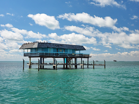 Stiltsville, Biscayne National Park, Florida - 03-01-2019: Leshaw House, one of seven remaining stilt houses over the grass flats of the park.