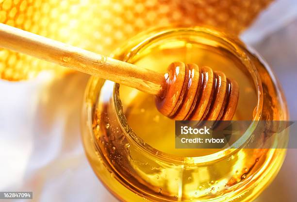 Honey In A Glass Jar Next To Honeycombs Stock Photo - Download Image Now - Honey, Bee, Honeycomb - Animal Creation