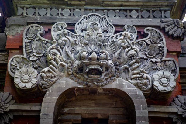 Singapore, Singapore - April 2, 2024. Historic carvings on wall along the trail in Fort Canning Park in Singapore