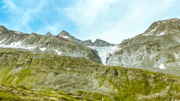 Worthington Glacier and Chugach Mountains in Summer The Worthington Glacier is located near Valdez, Alaska. This glacier  is able to be reached by a car. Traveling along the Richardson Highway, this glacier is a popular stopping ground for many tourists. On this day it is apparent that a Summer of heavy rain has caused the glacier to melt and recede. Worthington stock pictures, royalty-free photos & images