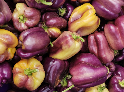 Purple eggplants on a market stall, close-up